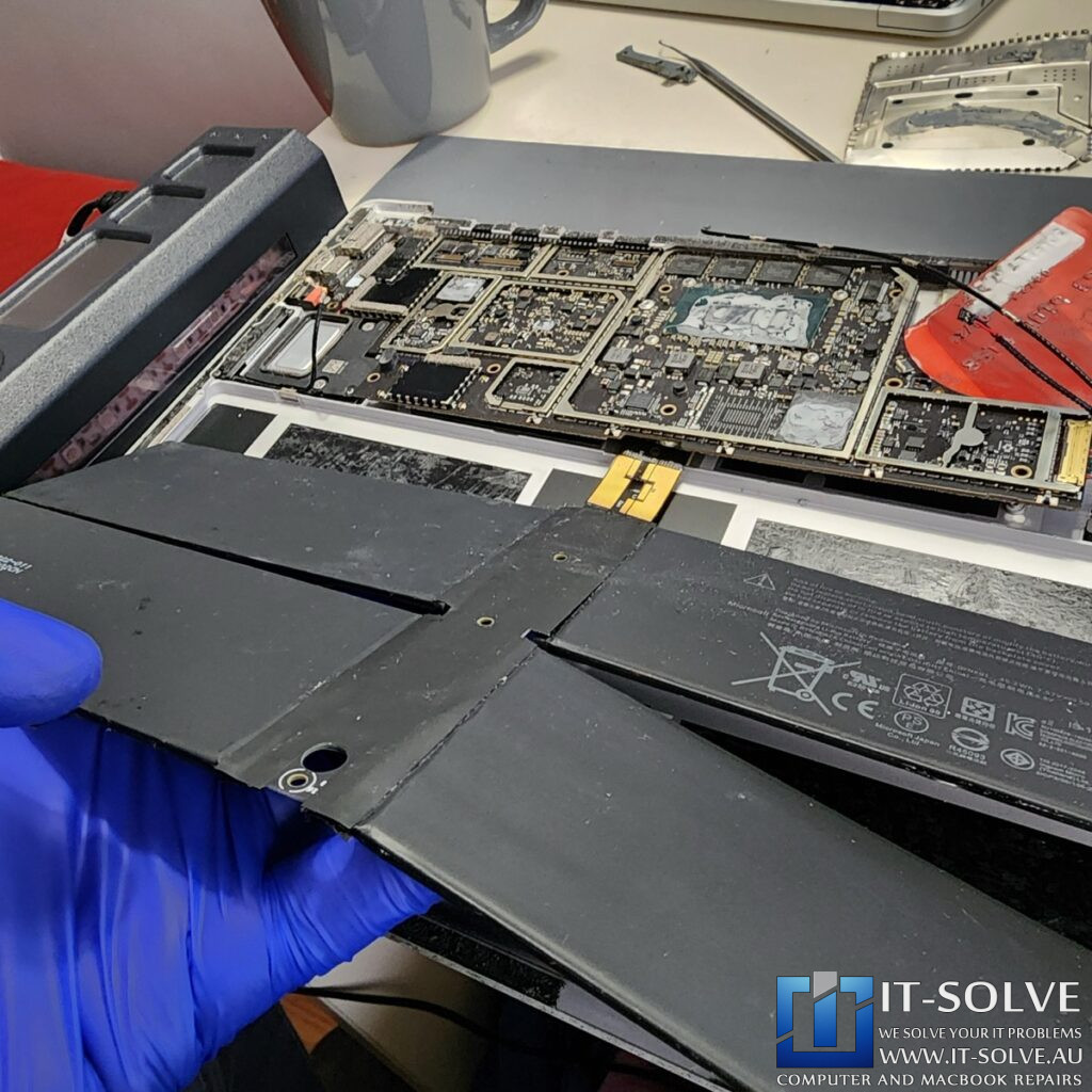 Photo of the genuine battery with matching model and part numbers