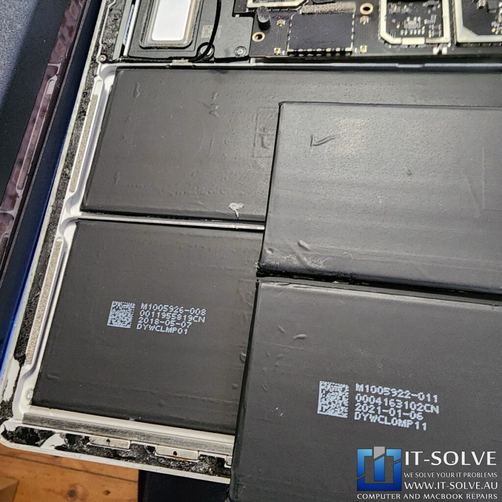 Photo of the genuine battery with matching model and part numbers